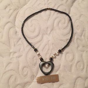 Necklace.  Opens in the back with a gold clasp